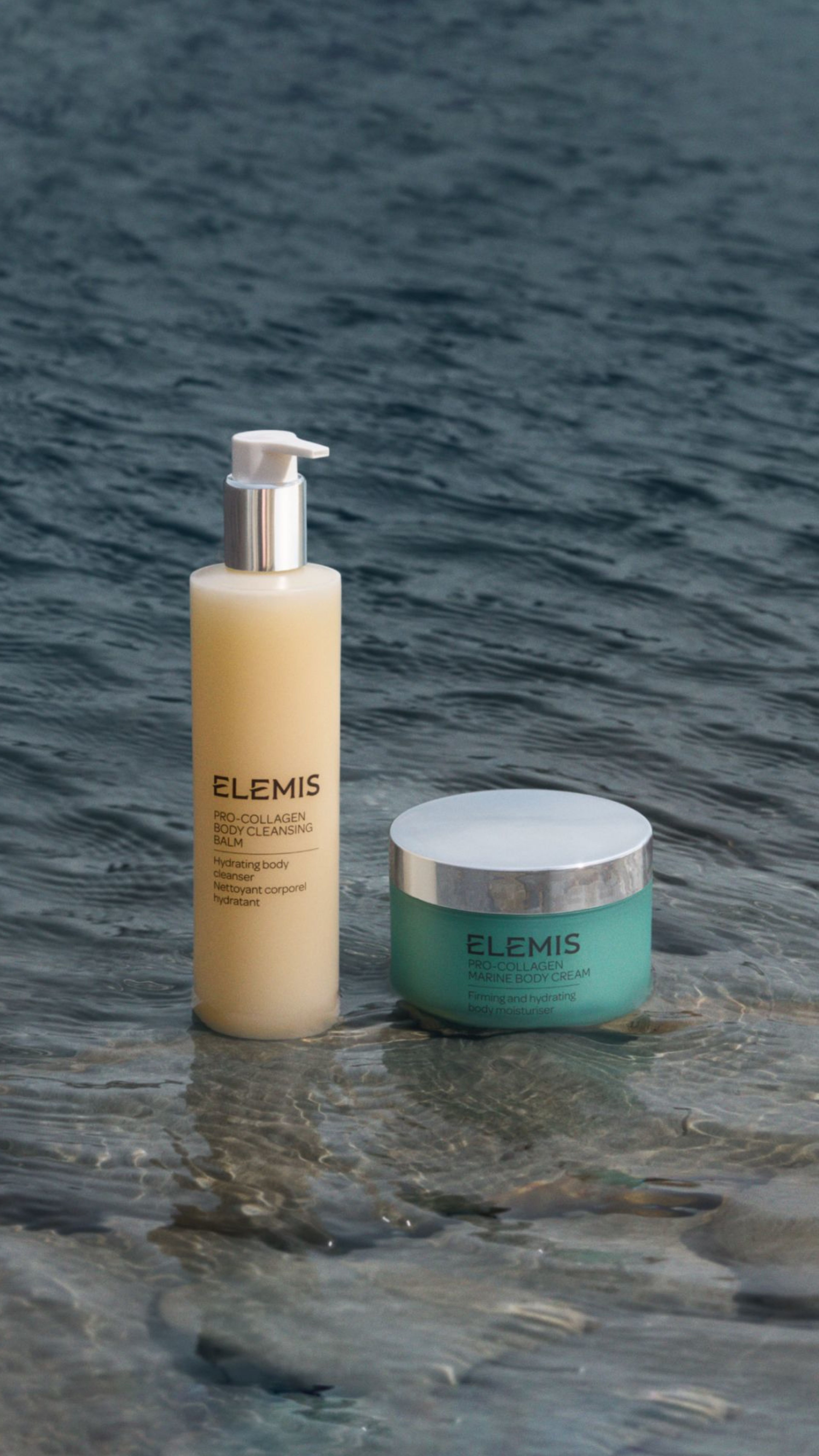 Elemis Pro-Collagen Body Cleansing Balm and Muscle Cool Cream in shallow rippling water.