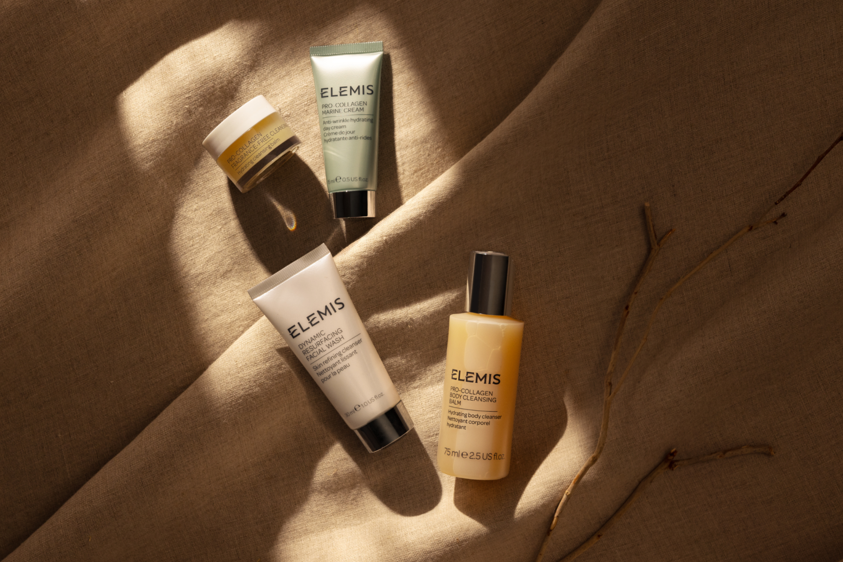 Elemis products on tan rock.