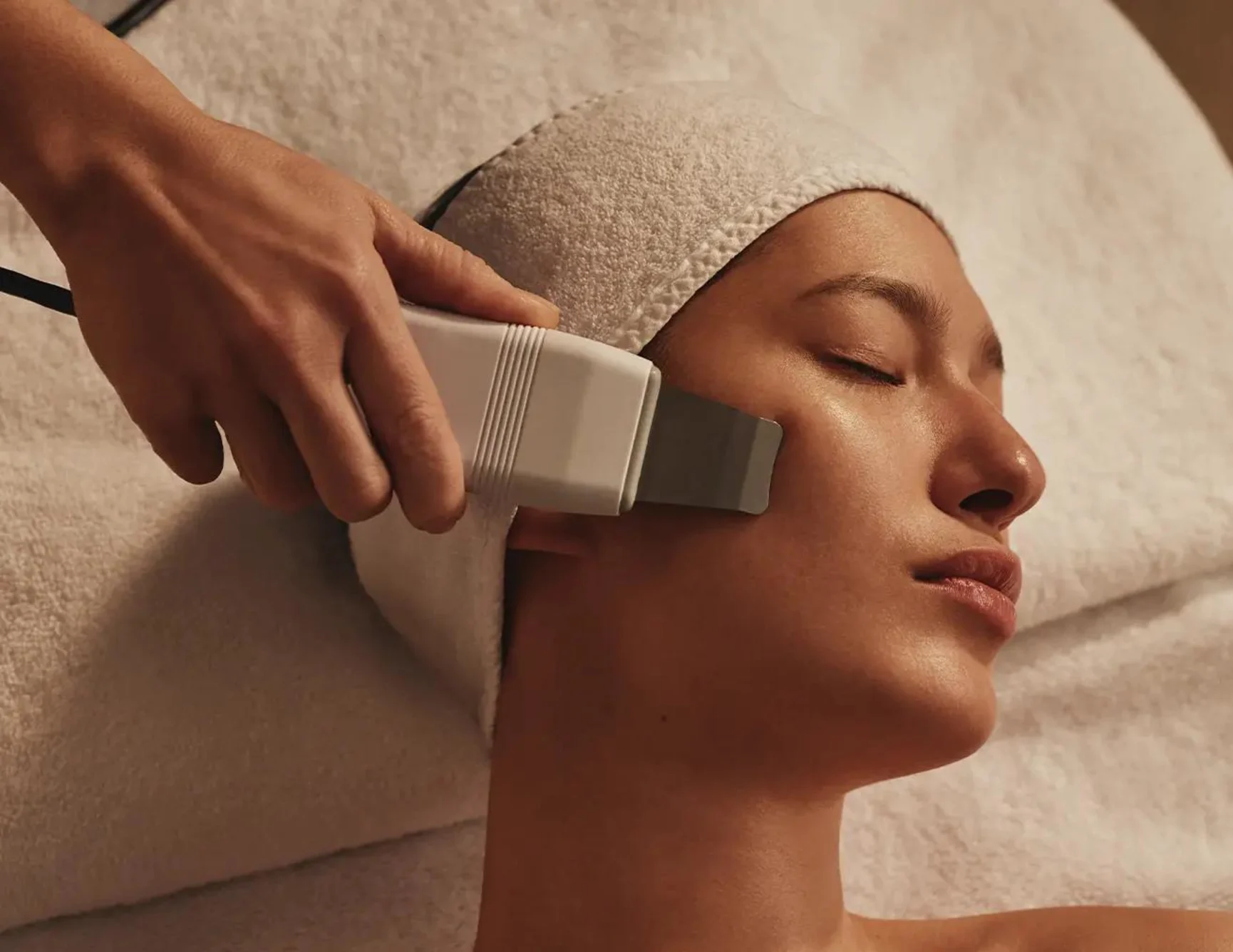 Woman receiving a microcurrent facial.