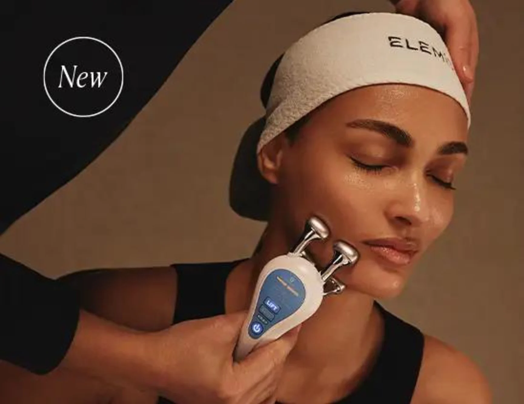 Woman receiving a microcurrent facial.