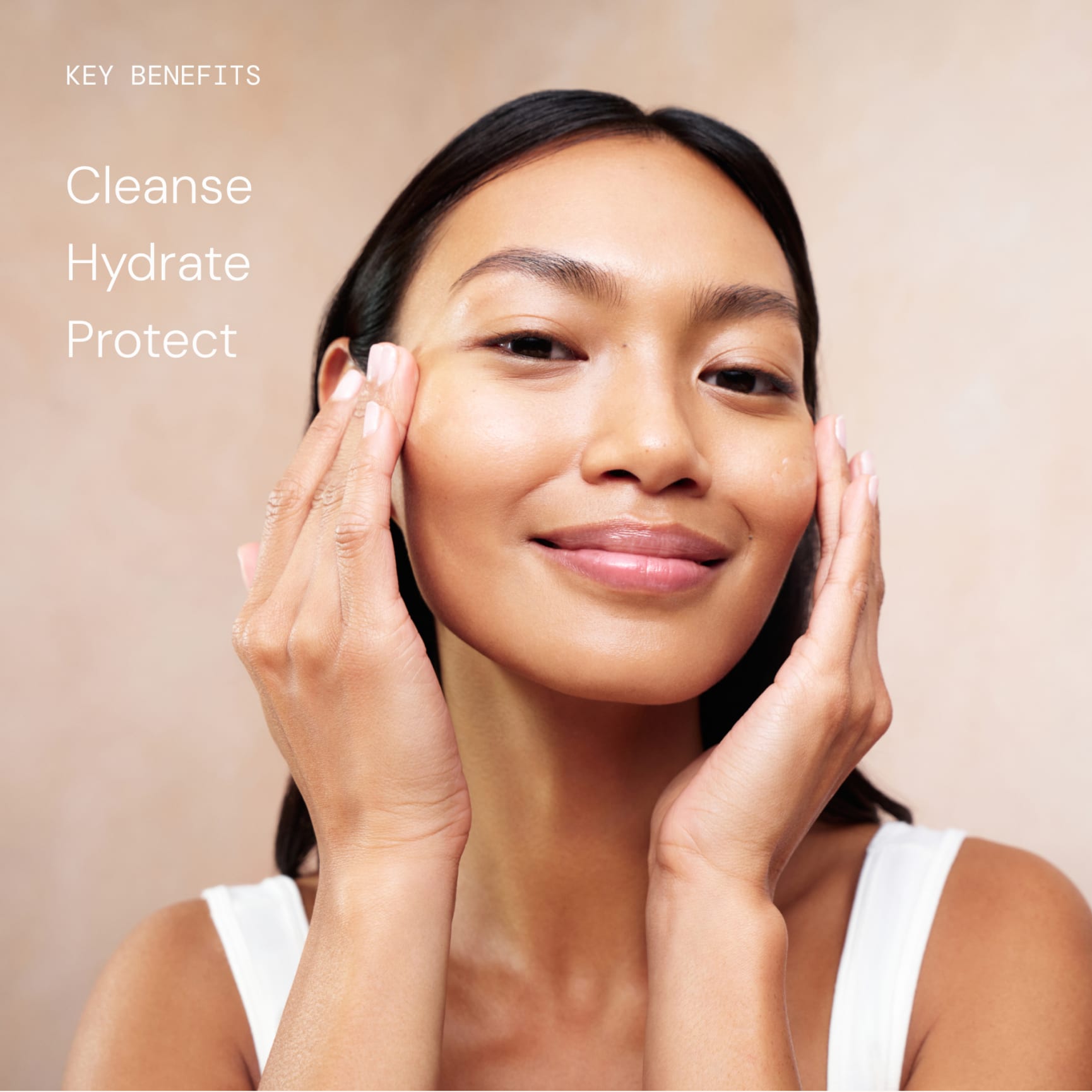 Woman gently massaging skincare into her cheeks and smiling, promoting a calm, hydrated complexion. On the left, text reads: “Key benefits: Cleanse, Hydrate, Protect.”