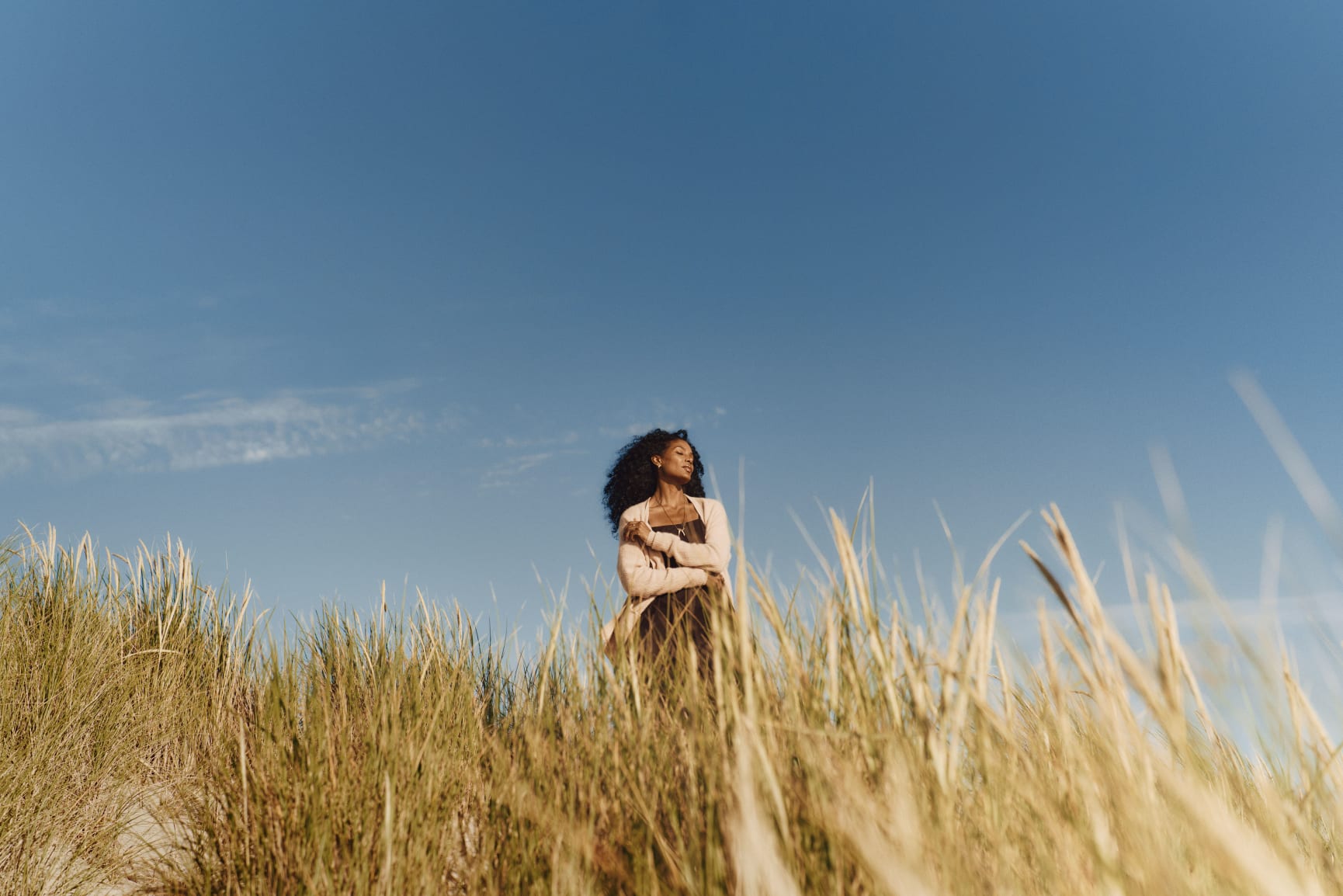 Woman in the sand dunes in the sun