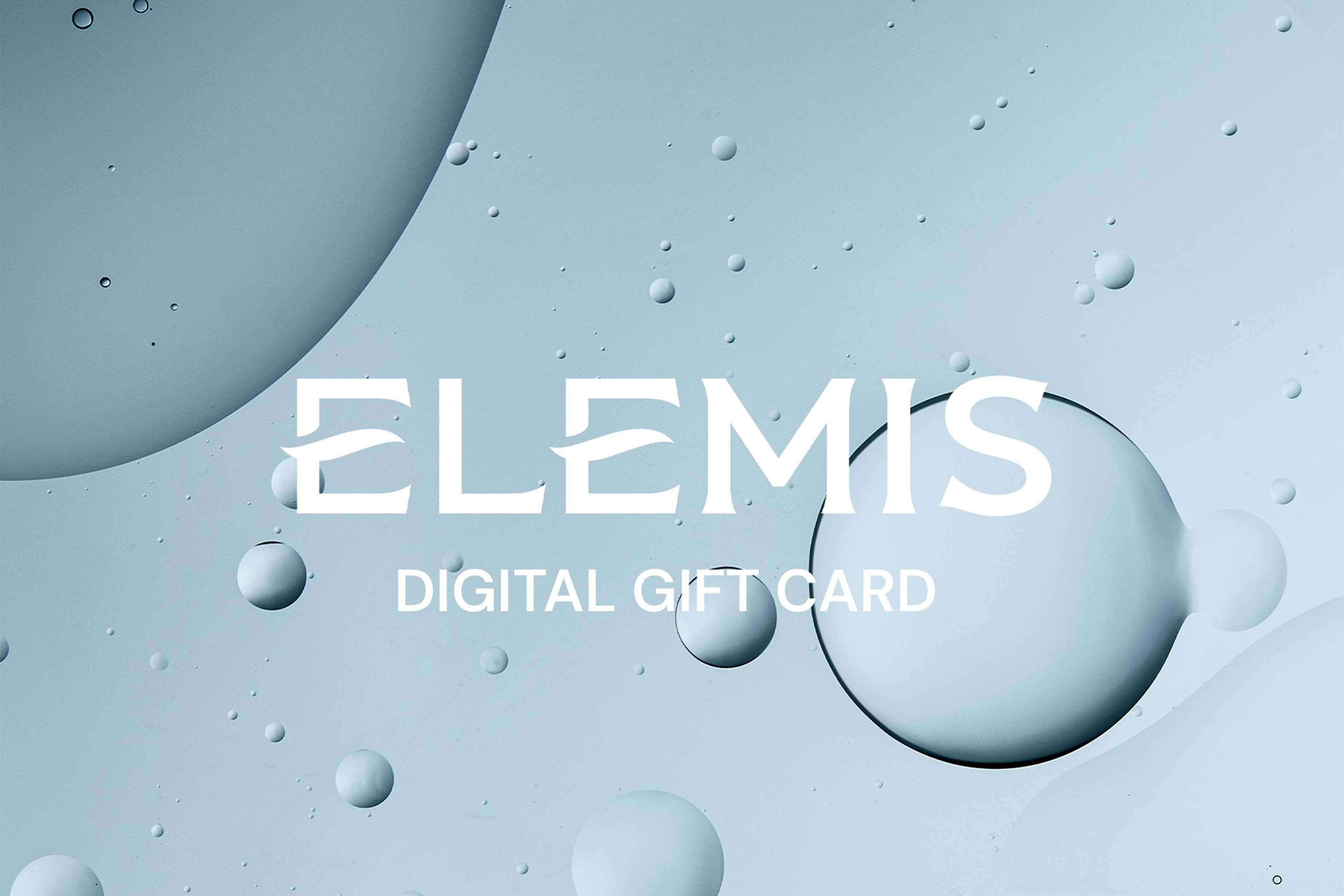 An open Elemis gift card holder showing a white "A SPECIAL GIFT FOR YOU" message and a dark blue gift card.