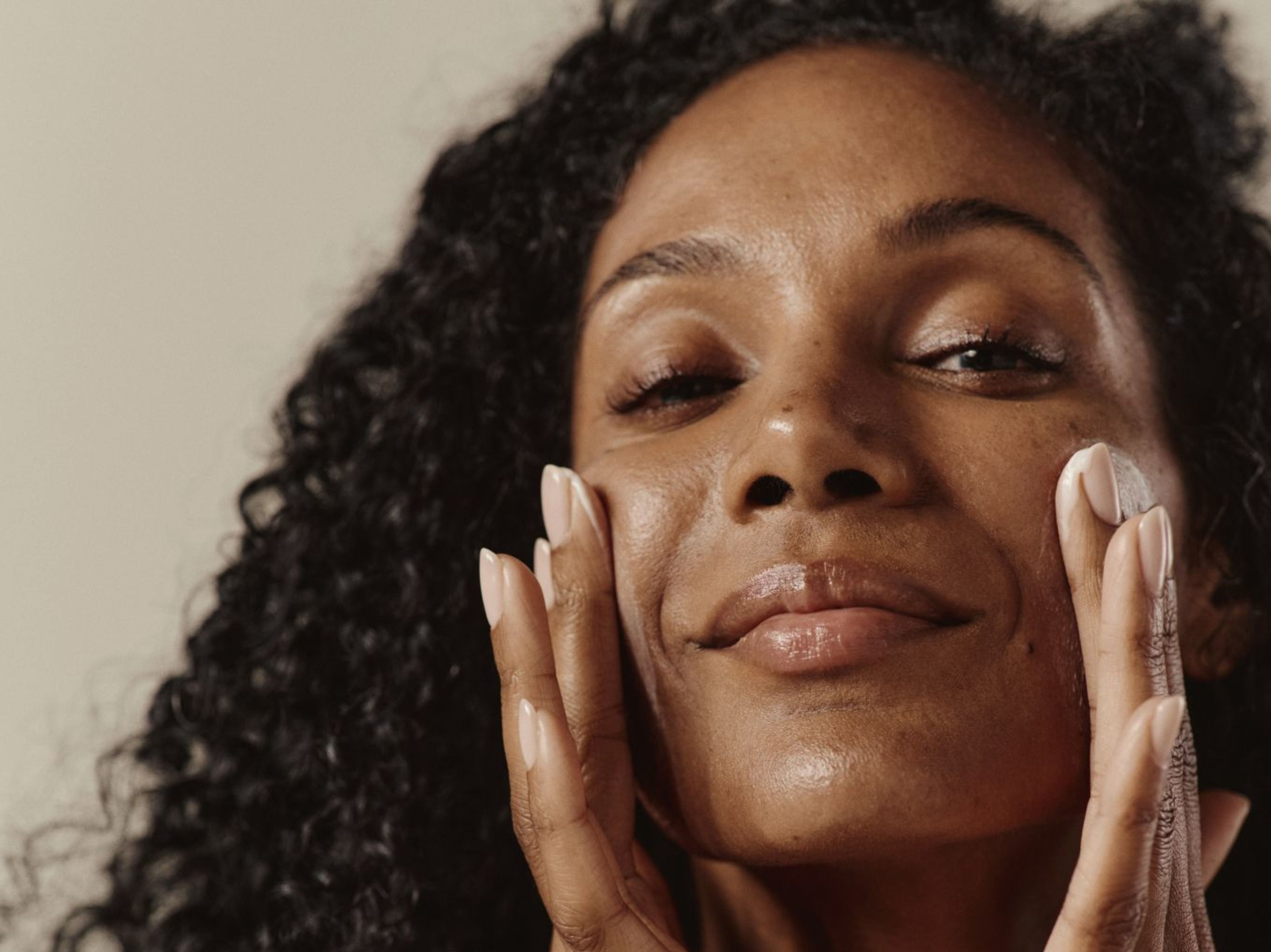 Lady rubbing her face