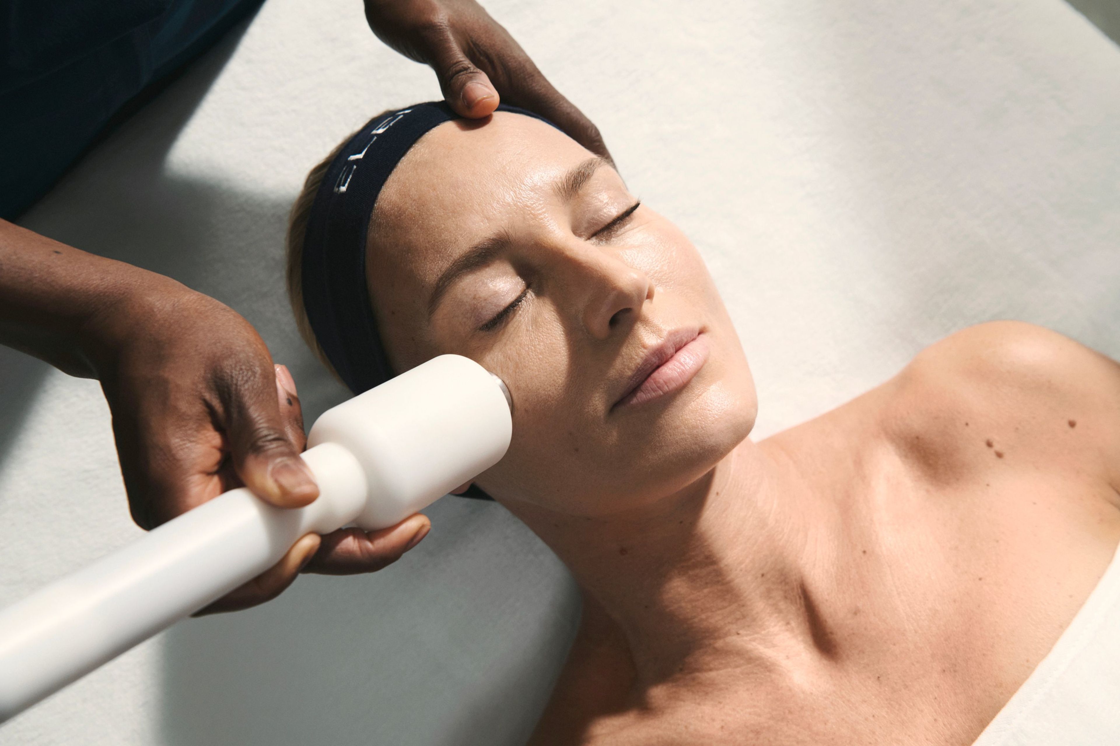 A man receives a back massage on a massage table.