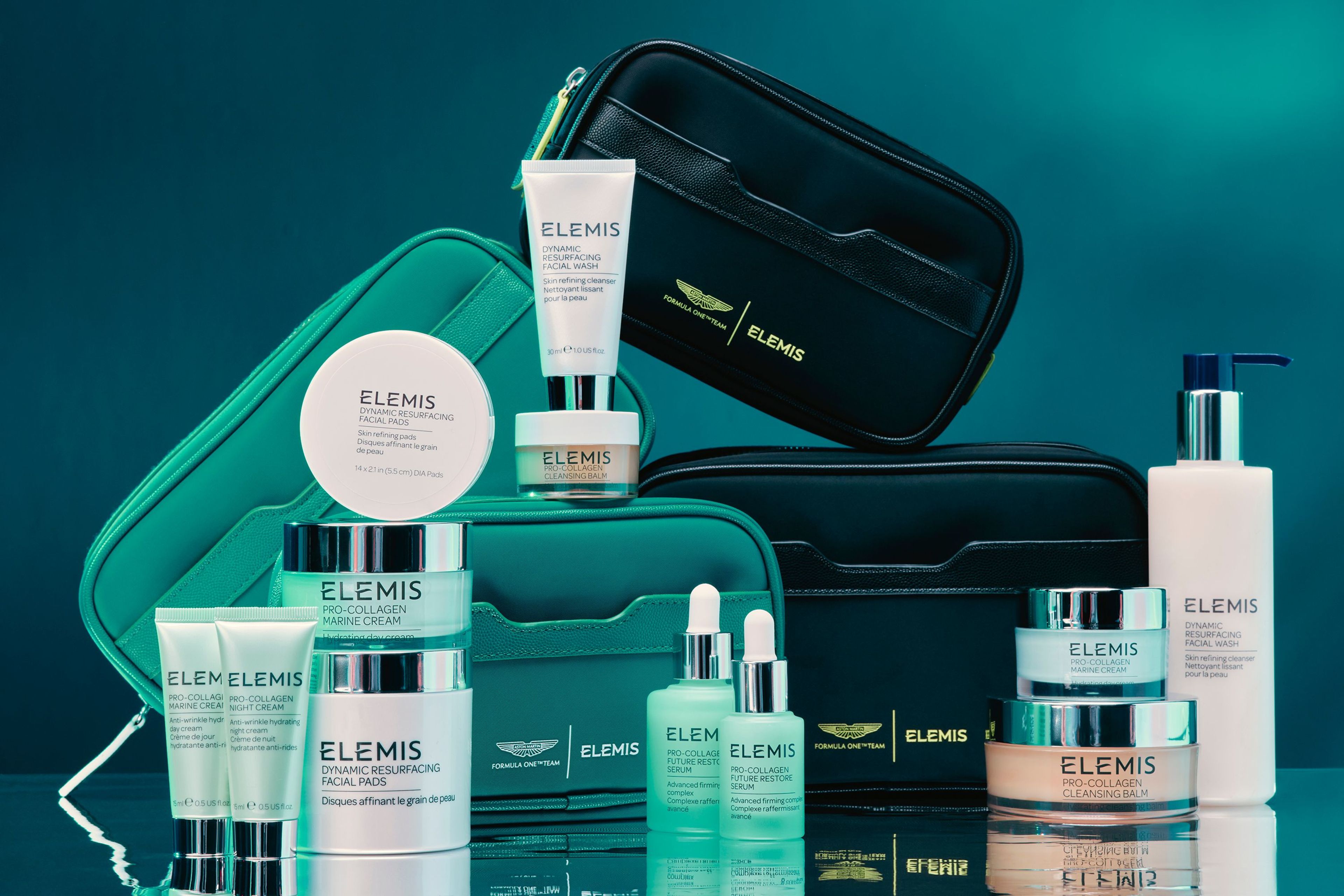 Elemis skincare products and teal and black travel bags, some featuring an Aston Martin logo.