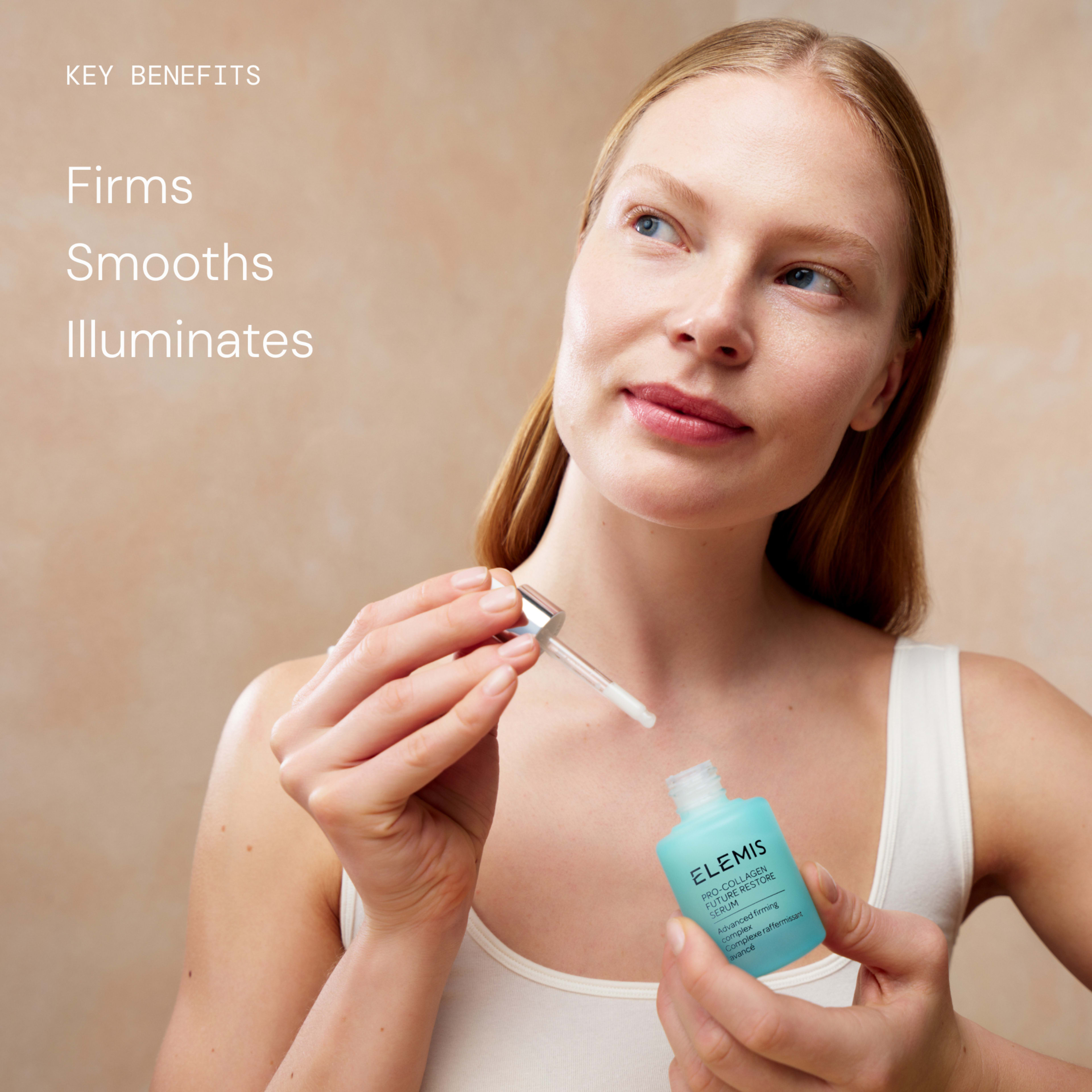 Woman applying ELEMIS skincare serum from a turquoise dropper bottle, looking slightly upward with a soft smile against a neutral background. On the left, text reads: "Key benefits: firms, smooths, illuminates."