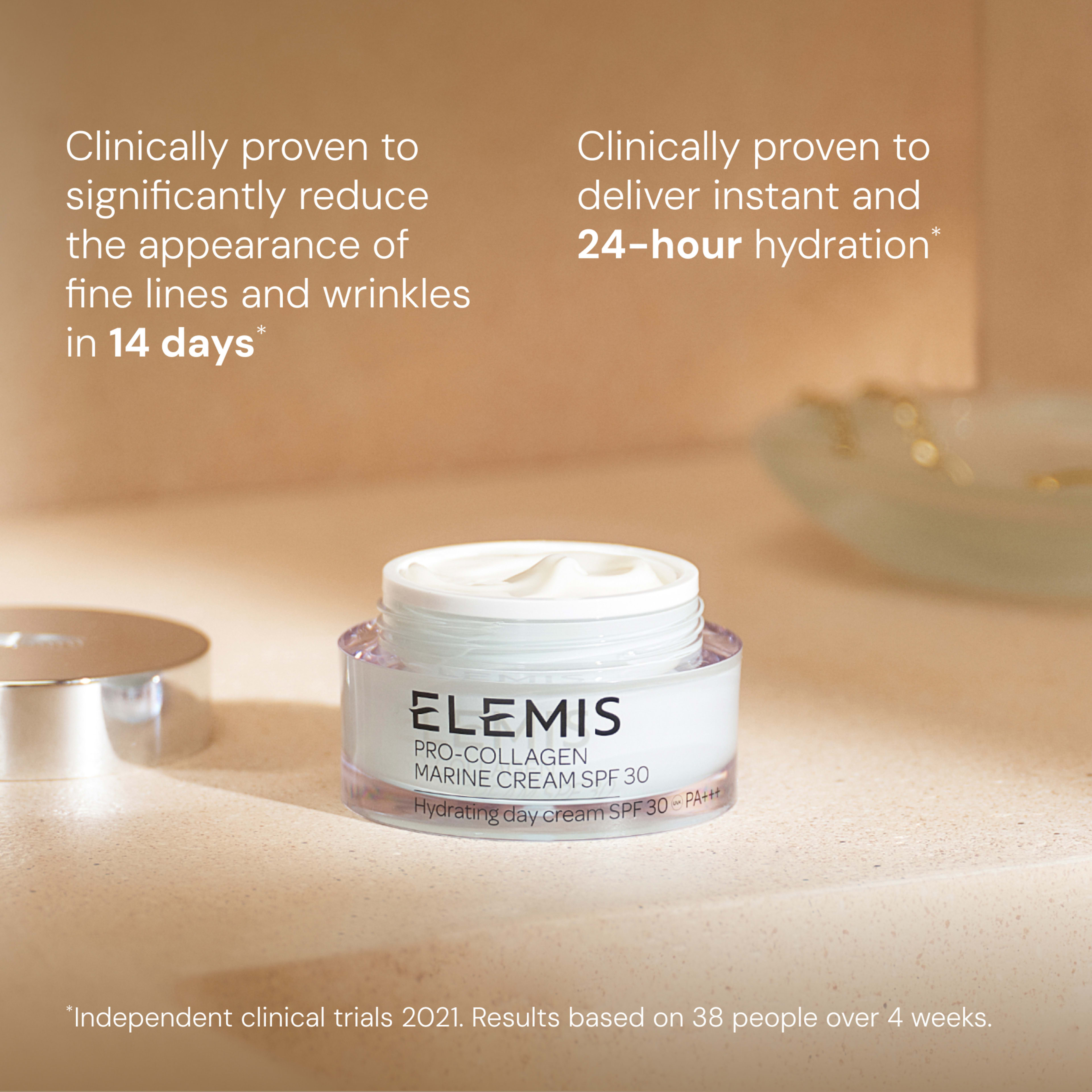 ELEMIS Pro-Collagen Marine Cream SPF 30 hydrating day cream jar on a bathroom counter with lid beside it. Text reads: Clinically proven to reduce fine lines and wrinkles in 14 days and deliver instant and 24-hour hydration; based on 38 people over 4 weeks.