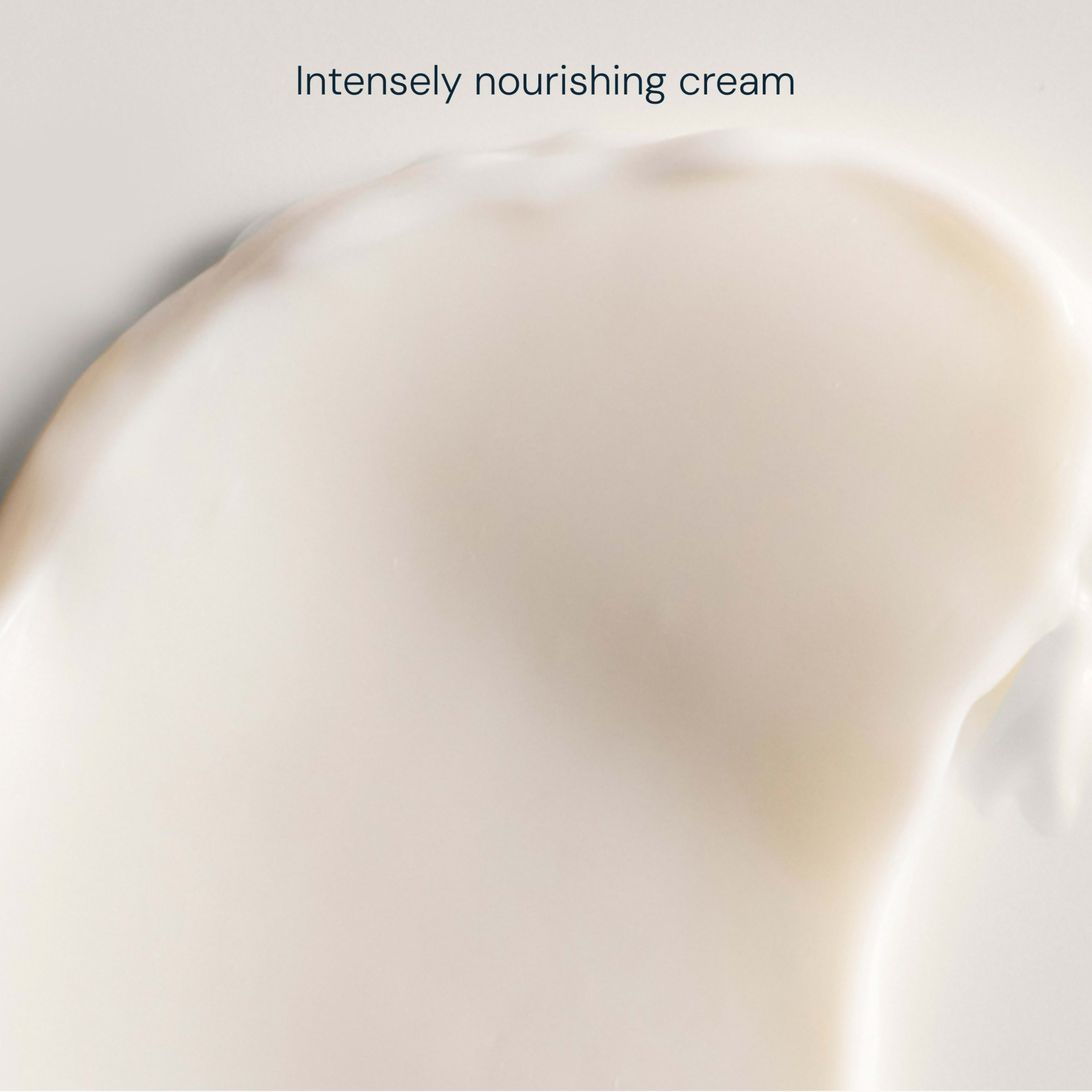 Creamy off-white skincare swatch with smooth, glossy texture against a pale background, captioned "Intensely nourishing cream".