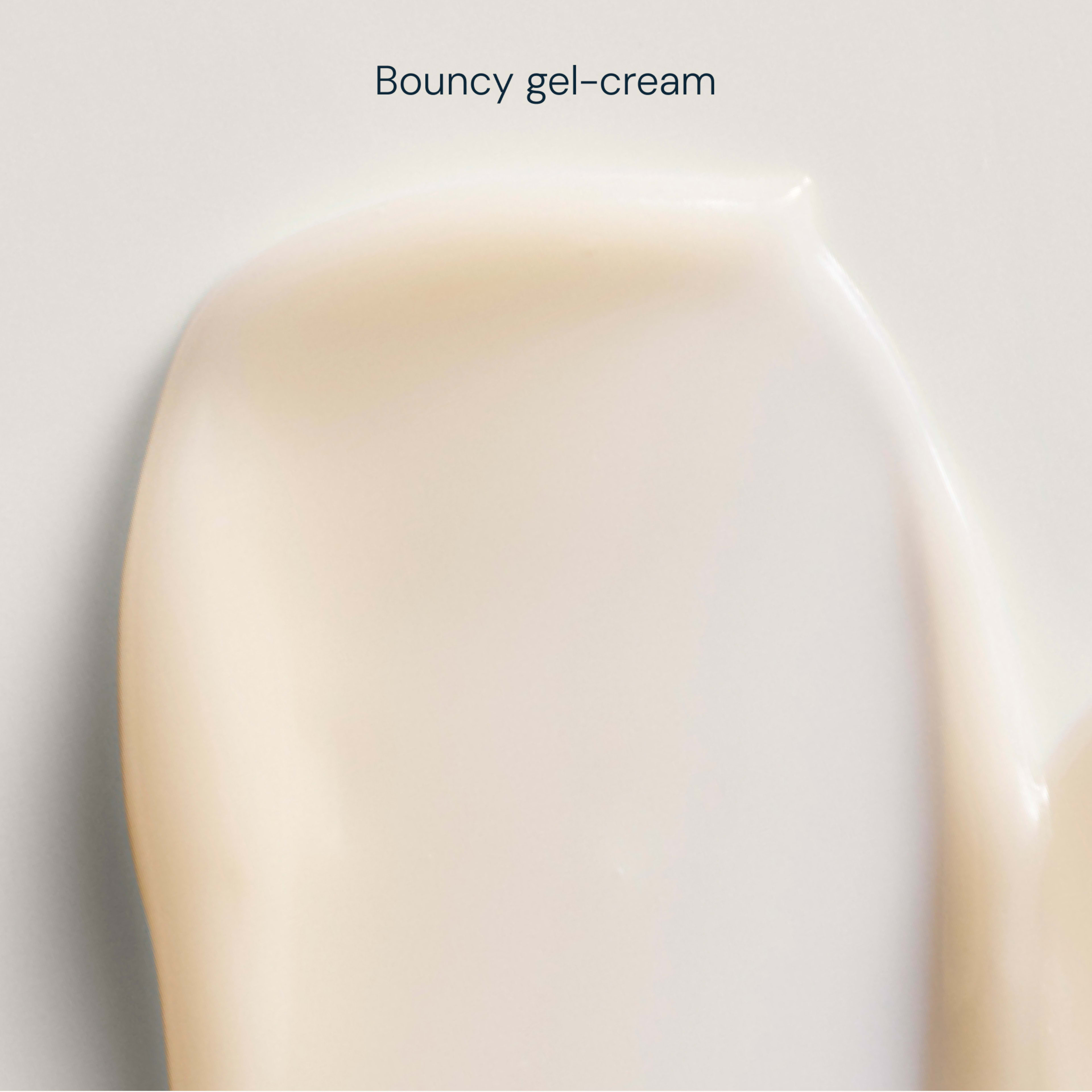 Close-up swatch of a smooth, pale ivory bouncy gel-cream texture with soft sheen on a light background, with the text “Bouncy gel-cream” above.
