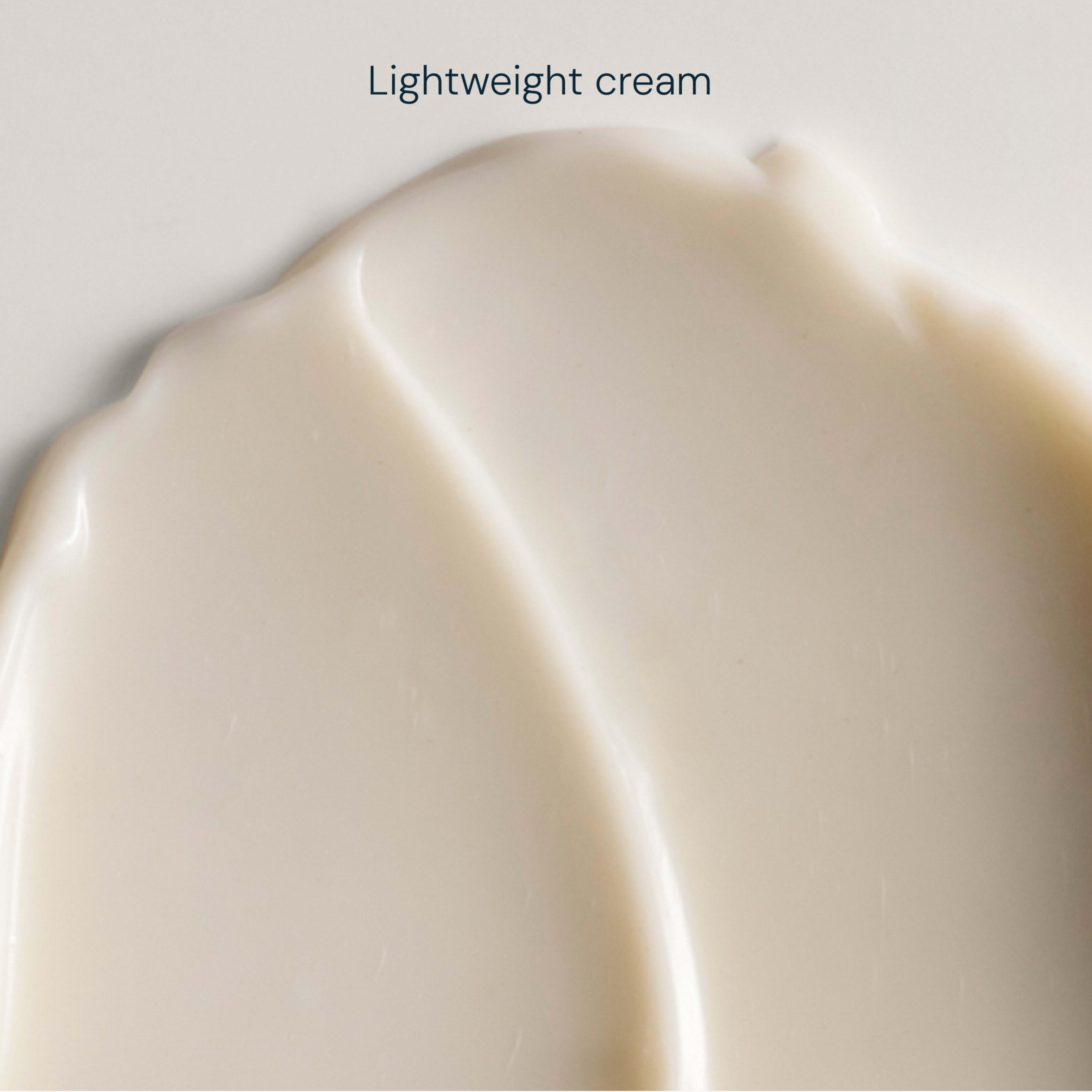 Close-up swatch of smooth, pale cream with the words "Lightweight cream" above.