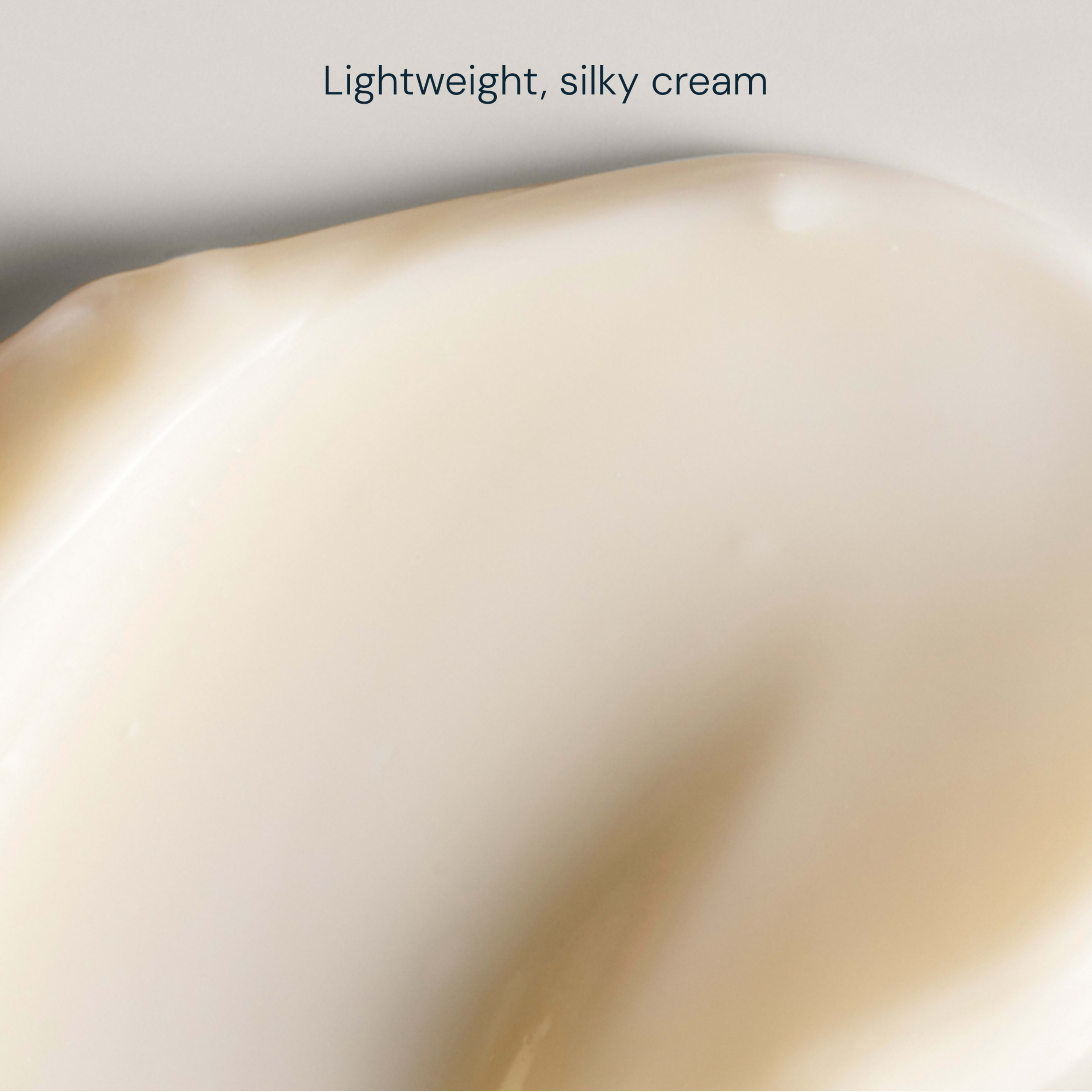 Close-up swatch of pale cream with a smooth, glossy texture and soft curves, with the words "Lightweight, silky cream" above.