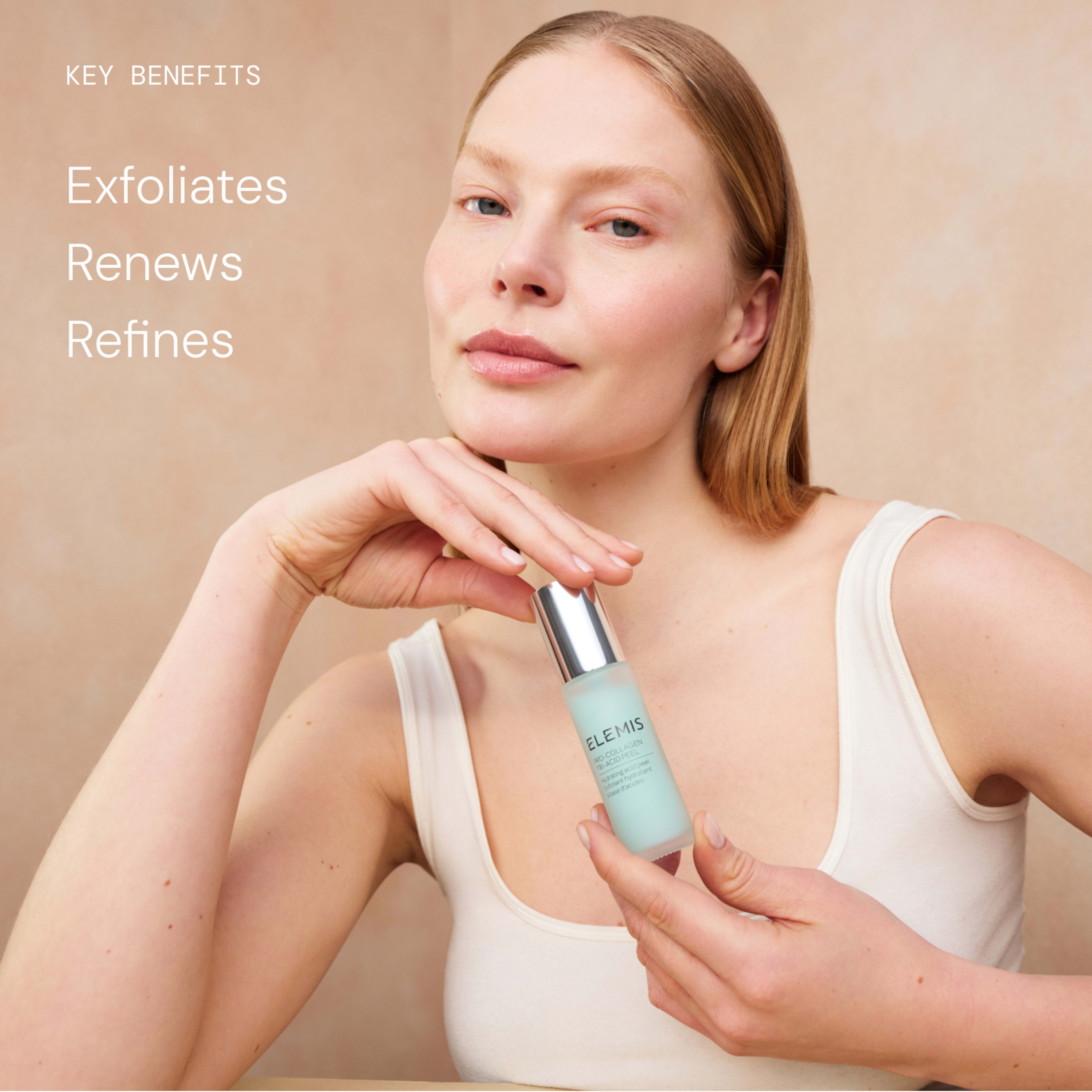 Woman in a vest top holding a bottle of ELEMIS skincare serum towards the camera, looking relaxed against a neutral background. On the left, text reads: "Key benefits: Exfoliates, Renews, Refines."