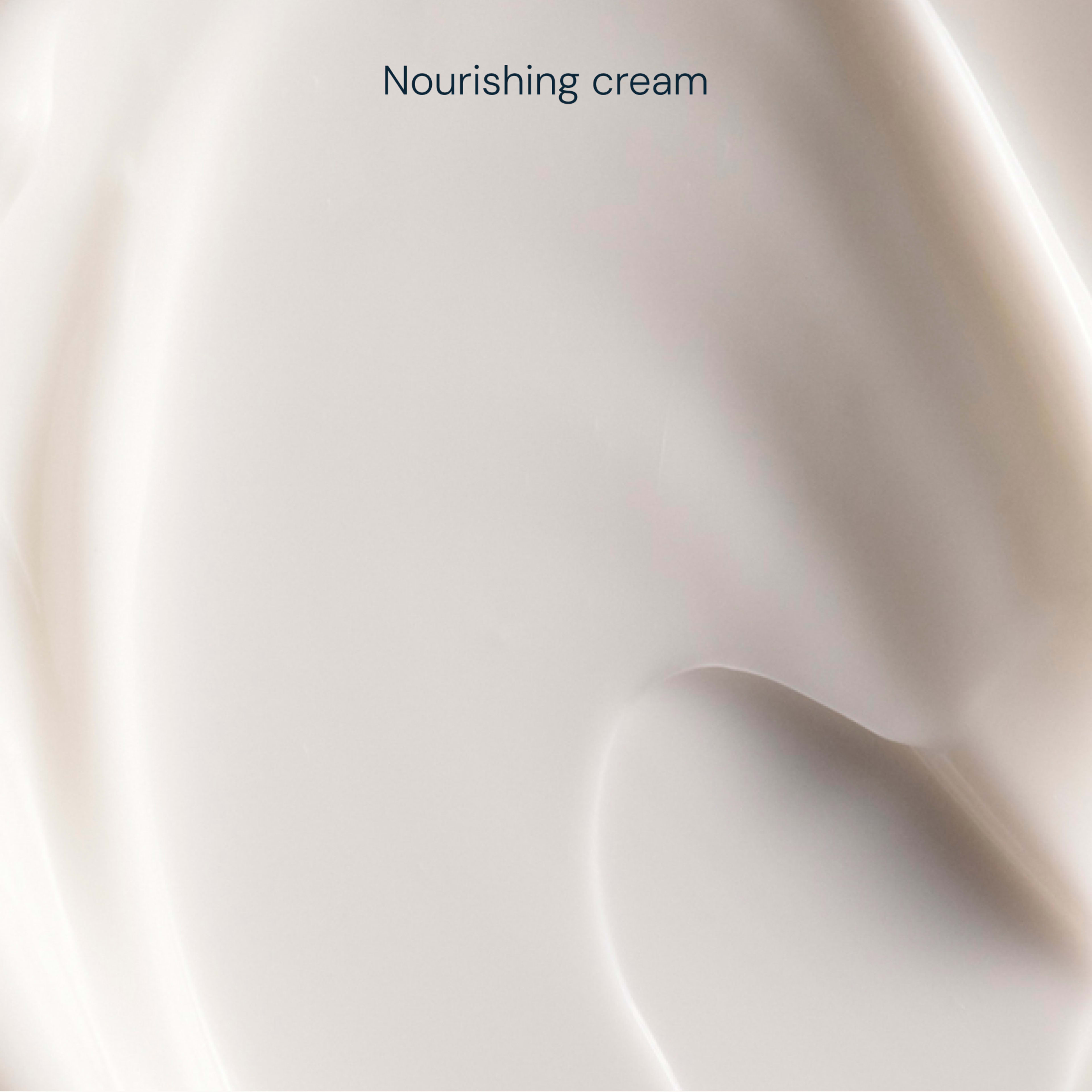 Close-up swatch of smooth, pale nourishing cream with soft curves and subtle highlights, with the words "Nourishing cream" at the top.