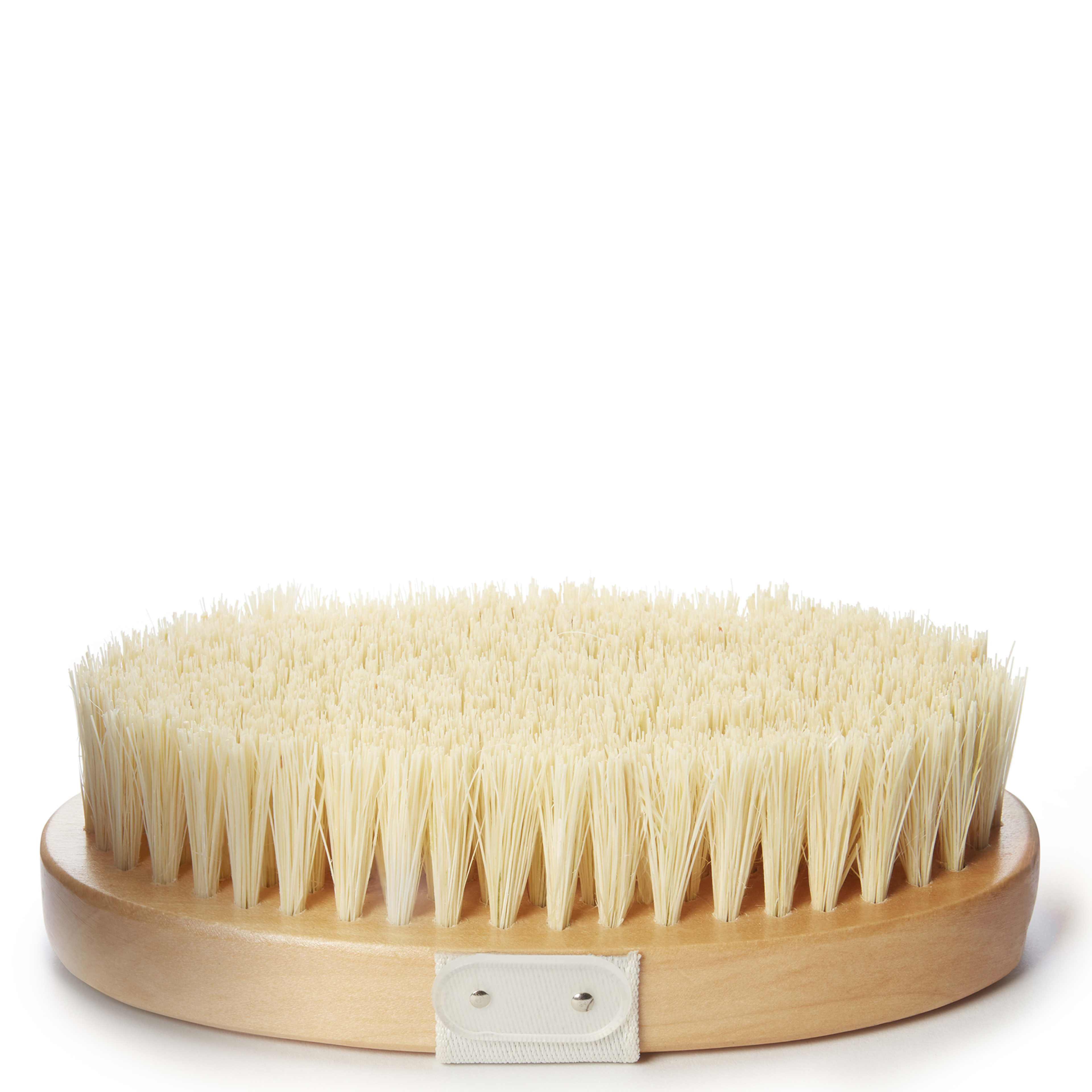 Round wooden body brush with dense, upright cream bristles and a small fabric hand strap on the side, shown against a white background.