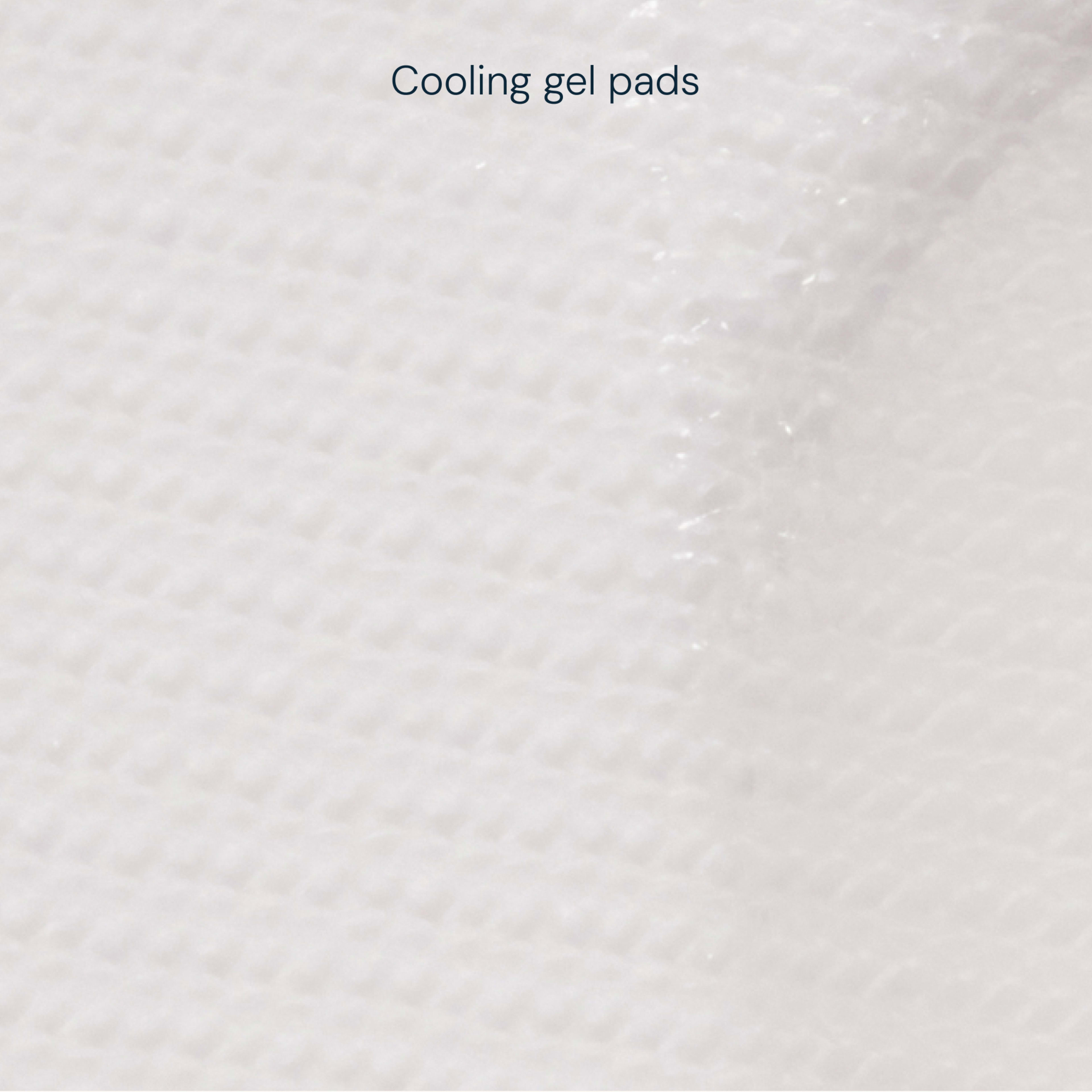 Close-up of white cooling gel pads showing a soft, textured surface with a subtle fold, labelled “Cooling gel pads” at the top.