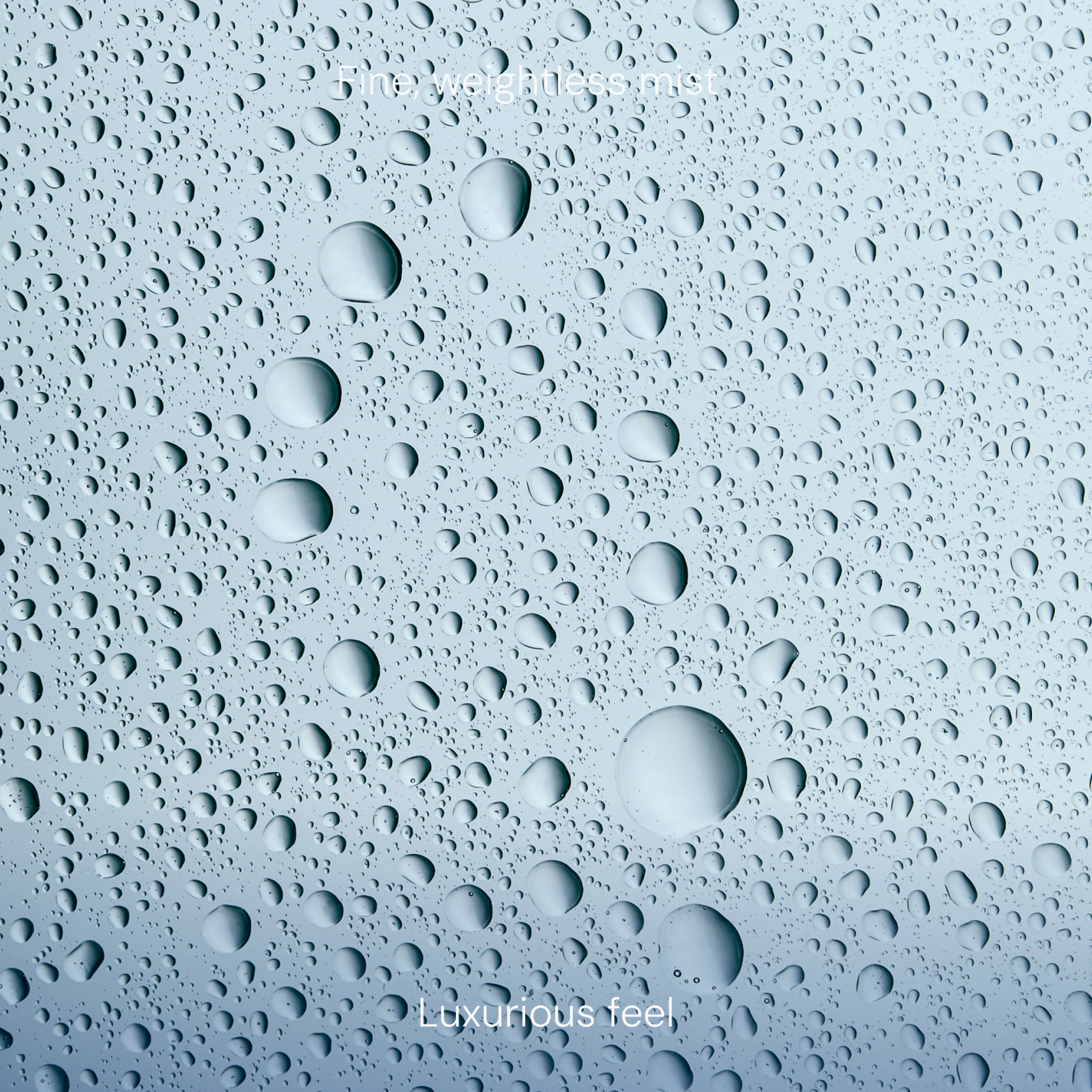 Close-up of water droplets on a pale blue surface with the text “luxurious feel” suggesting a smooth, indulgent texture.