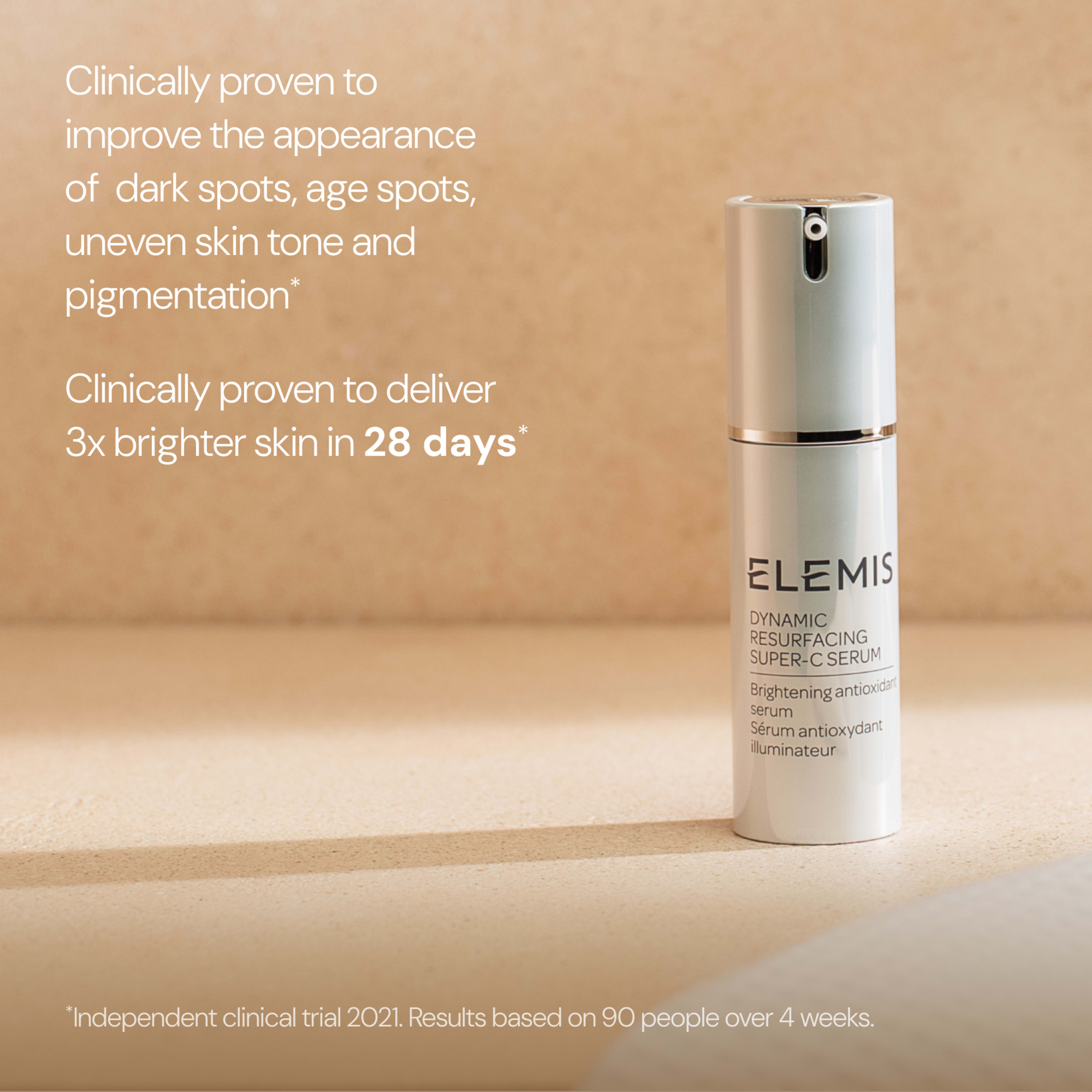 ELEMIS Dynamic Resurfacing Super-C Serum bottle on a beige surface with text stating it is clinically proven to improve dark spots, age spots, uneven skin tone and pigmentation, and deliver 3x brighter skin in 28 days, based on a 2021 clinical trial.