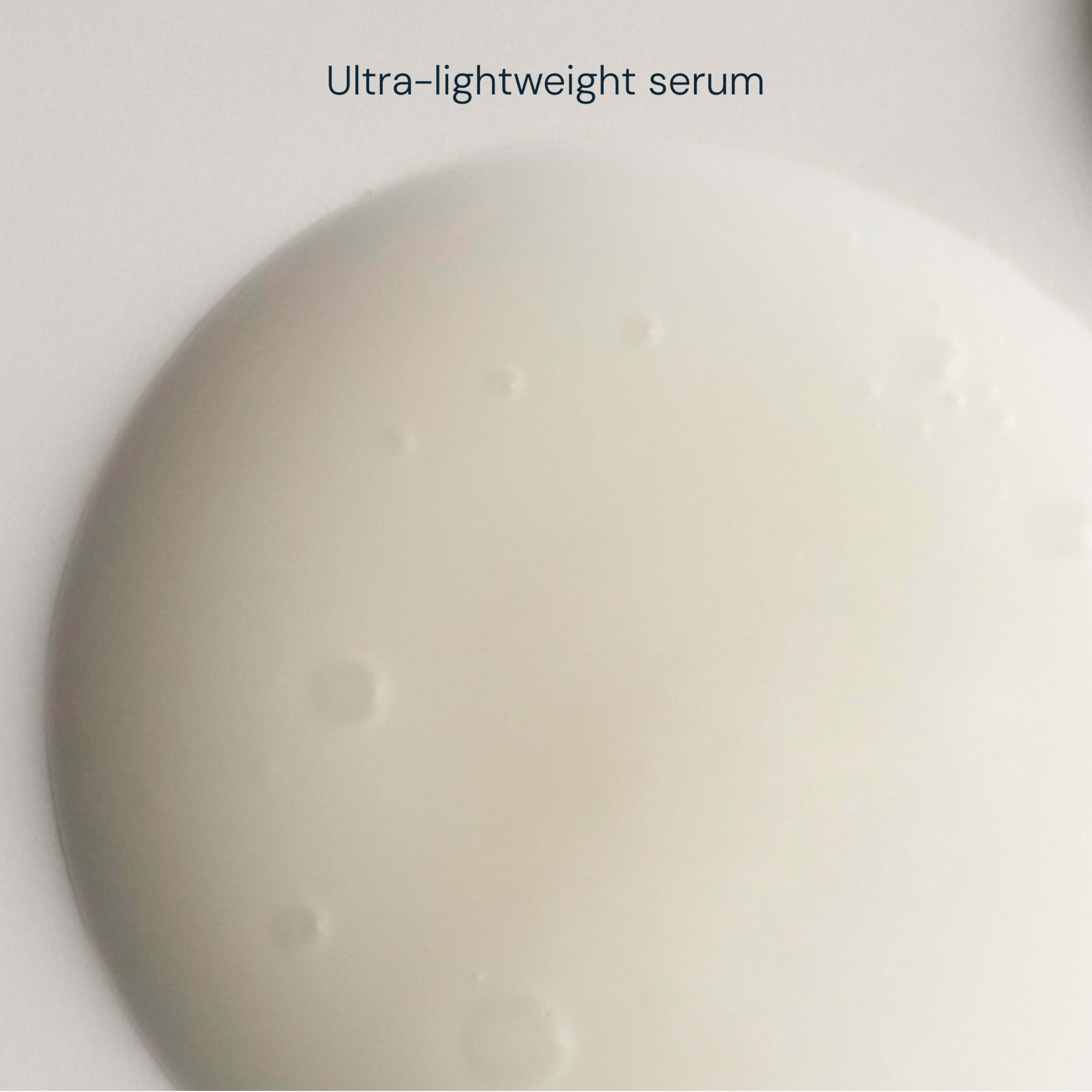 Close-up of a pale, ultra-lightweight serum droplet against a white background, with the text "Ultra-lightweight serum" above.