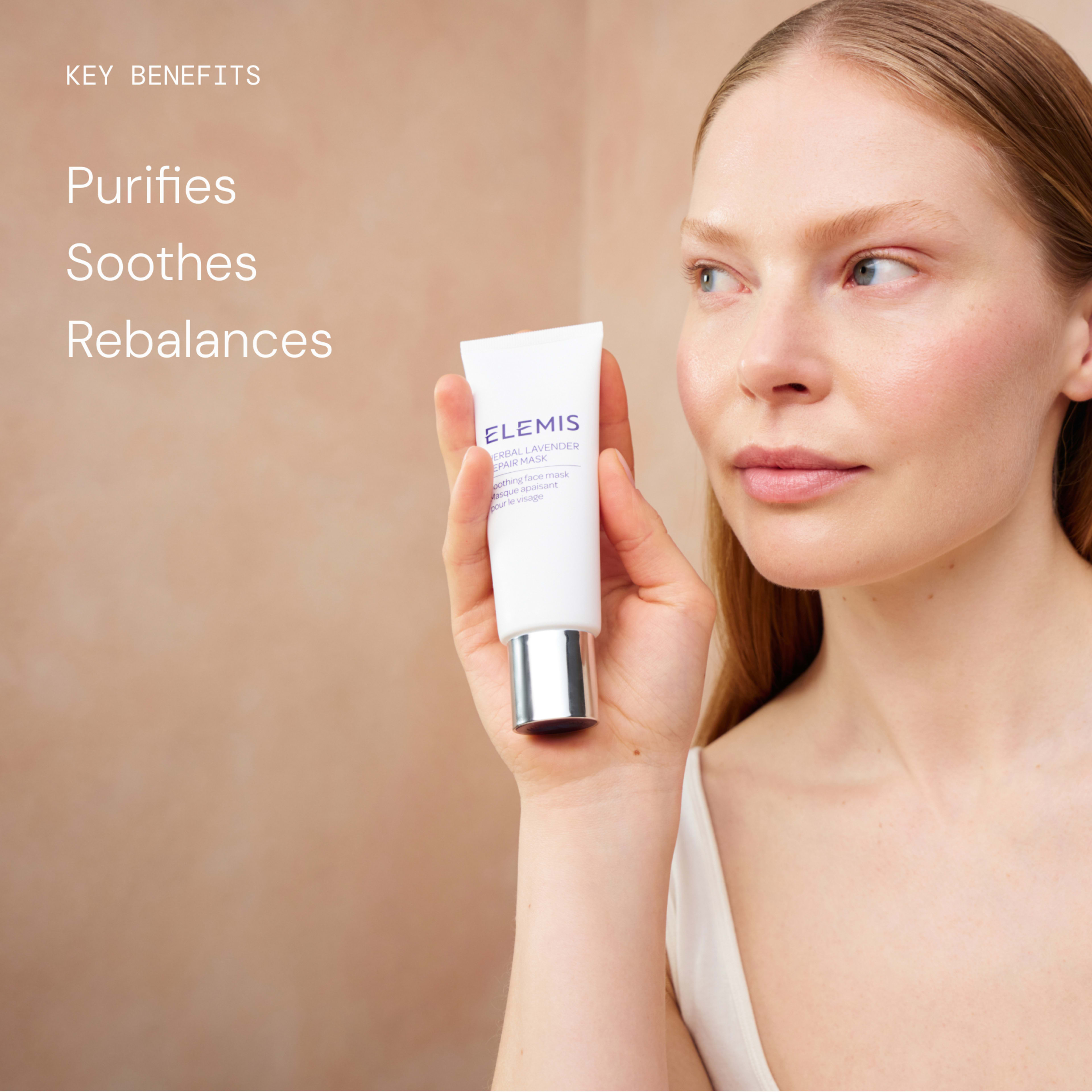 Woman with clear skin holds a tube of ELEMIS skincare beside her face against a neutral background. On the left, text reads: "Key benefits Purifies Soothes Rebalances".
