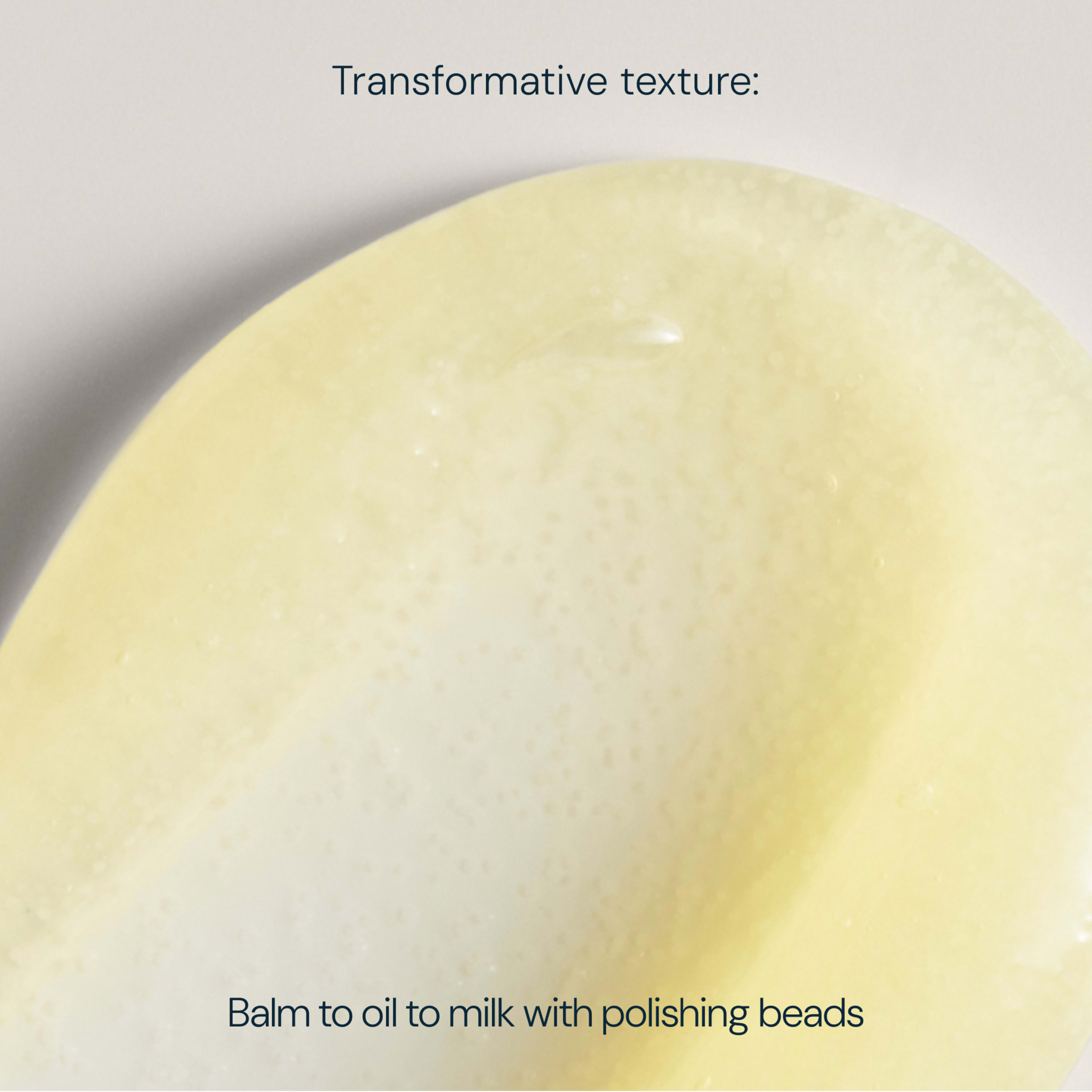 Close-up yellow ELEMIS skincare swatch with caption “Transformative texture: Balm to oil to milk with polishing beads” describing the product’s changing texture and gentle exfoliating beads.
