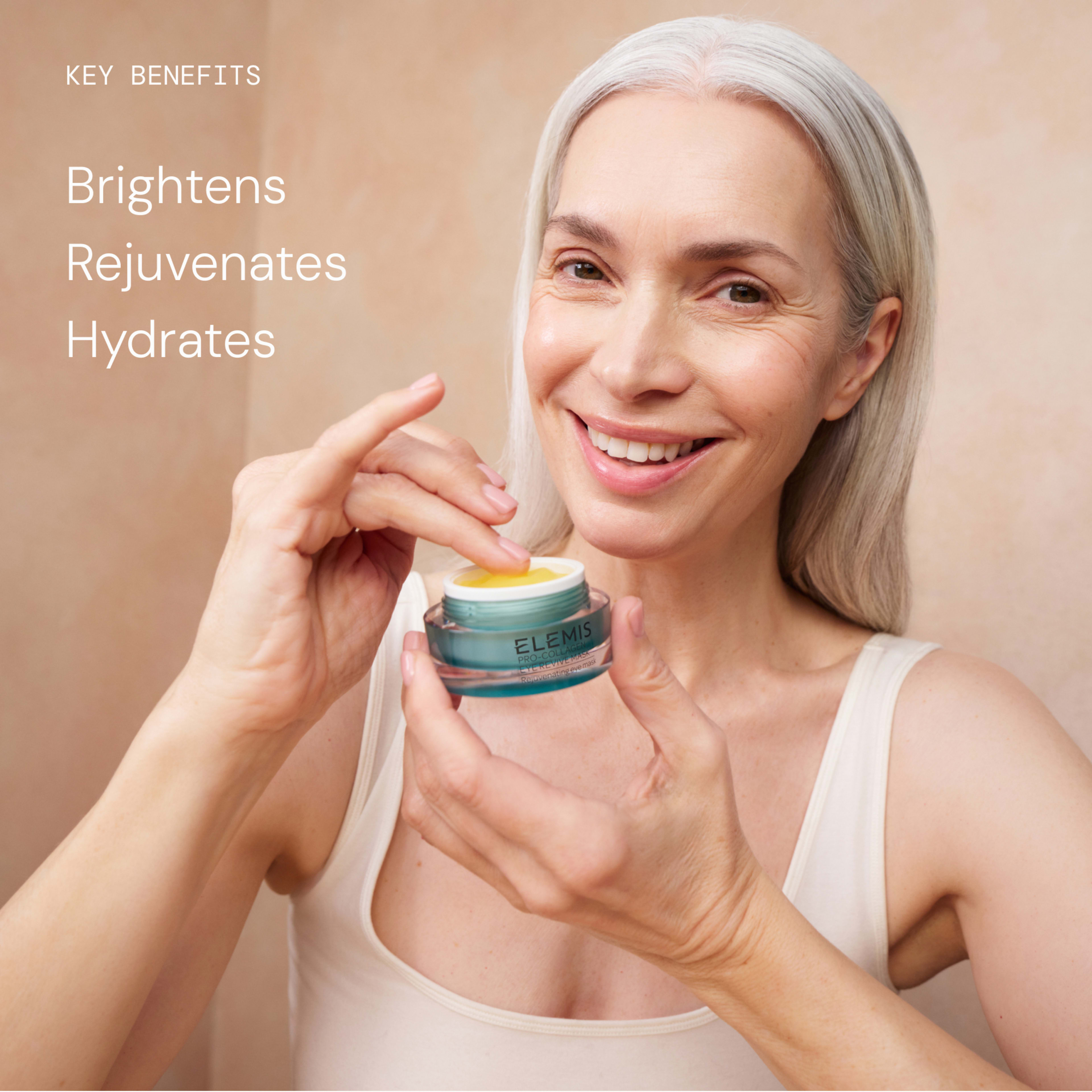 Smiling woman with long grey hair applies ELEMIS cream from a small blue jar, holding it up to the camera. Text on the left reads: “Key benefits: Brightens, Rejuvenates, Hydrates.”