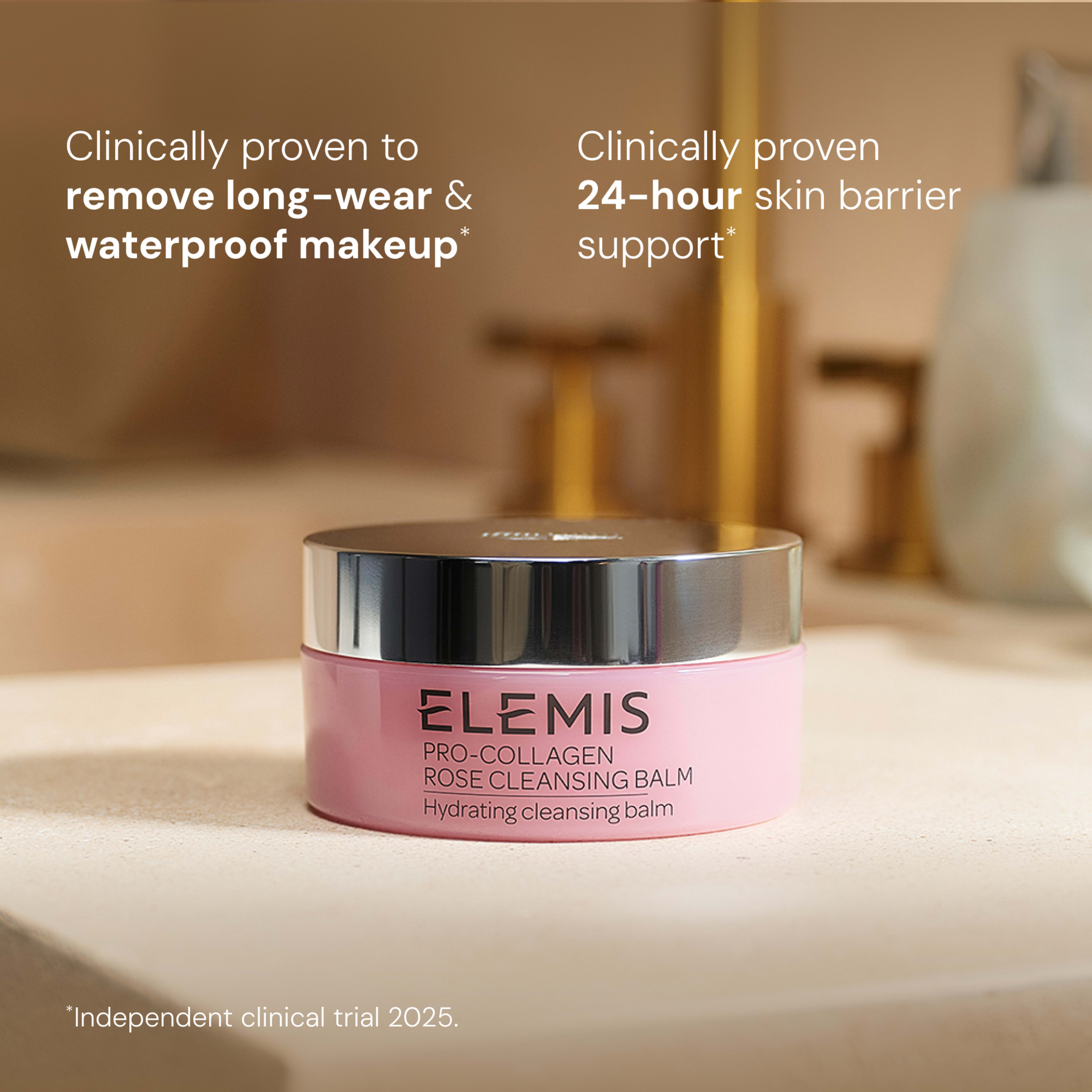ELEMIS Pro-Collagen Rose Cleansing Balm jar on a bathroom counter, promoted as a hydrating cleansing balm. On-image text: clinically proven to remove long-wear and waterproof makeup and provide 24-hour skin barrier support; independent clinical trial 2025.