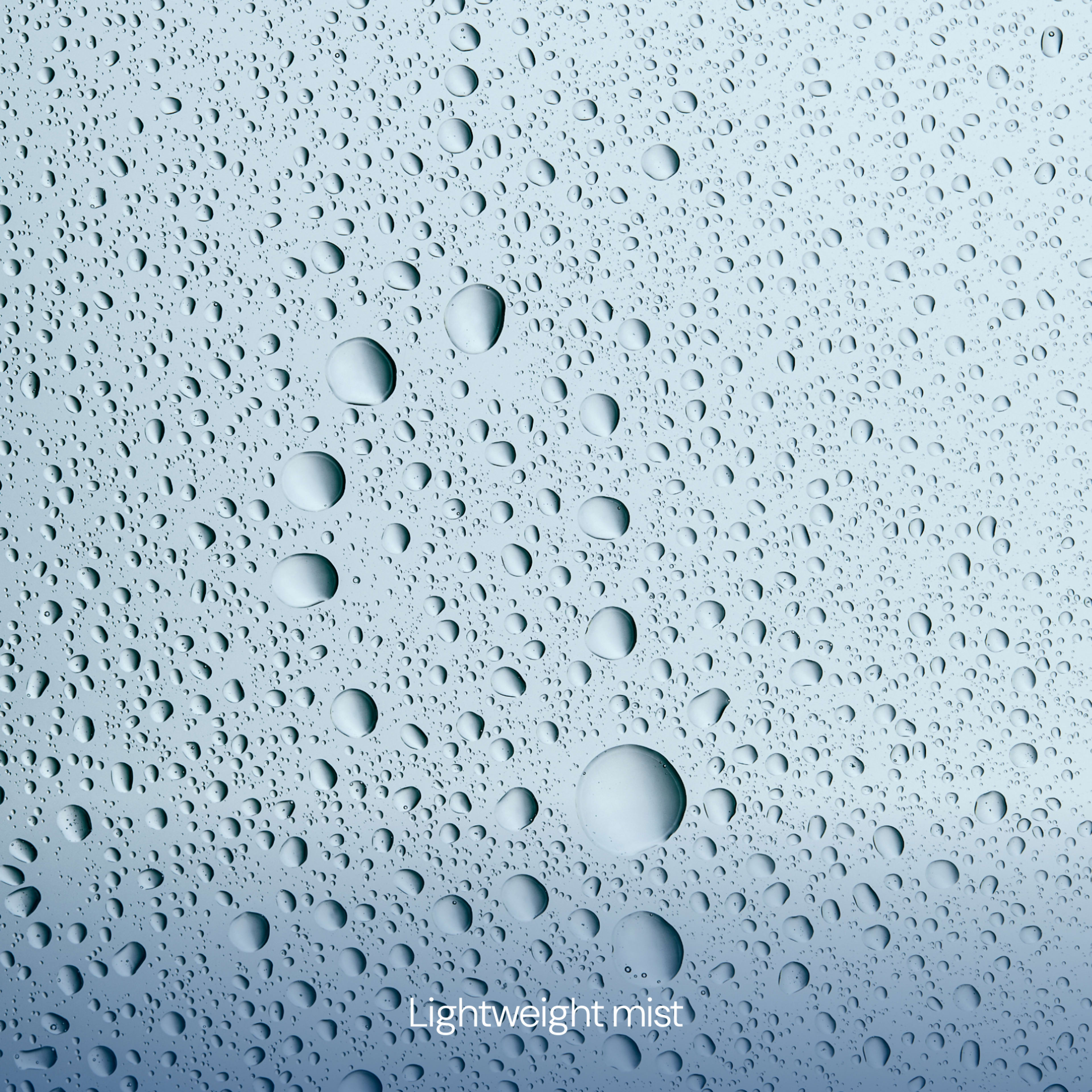 Pale blue surface covered in fine and larger water droplets, suggesting a fresh spray effect, with the words “Lightweight mist” in white text at the bottom.