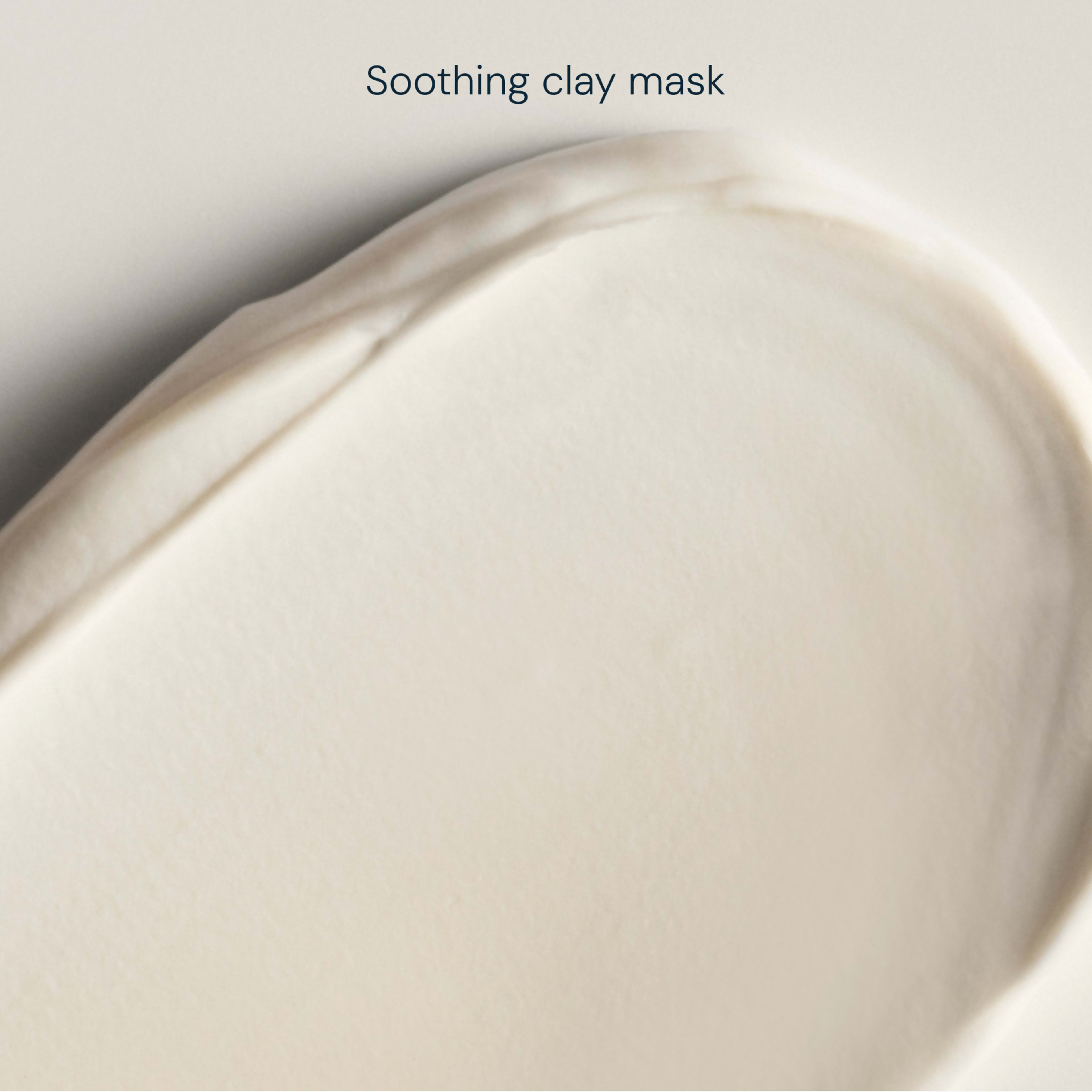 Creamy beige swatch of soothing clay mask, showing a smooth, velvety texture against a soft neutral background.