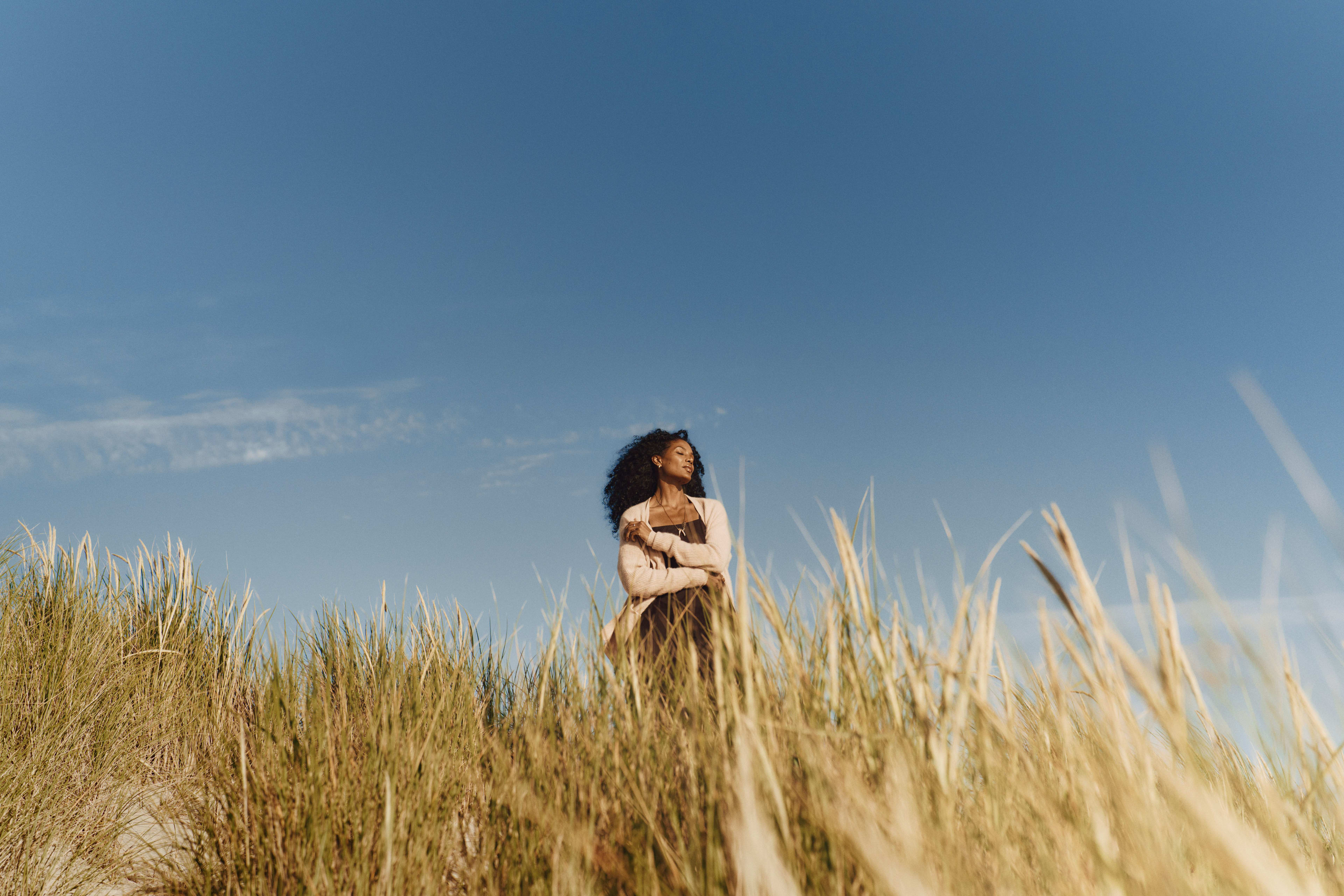 Woman in the sand dunes in the sun